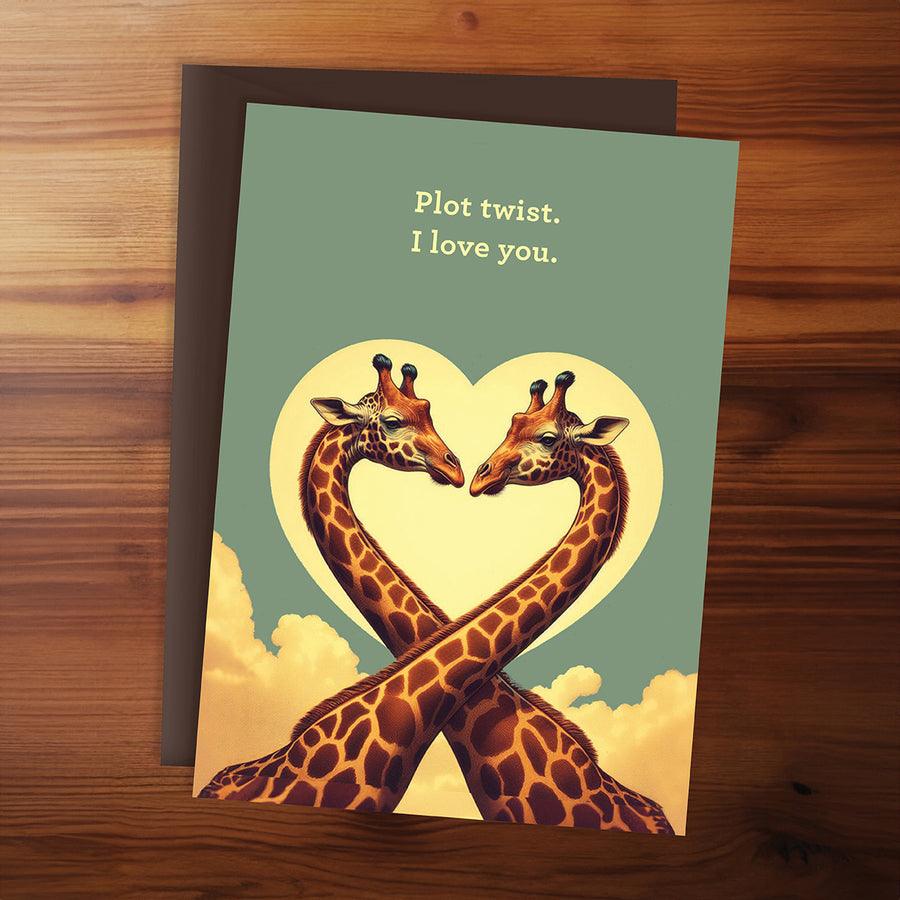 Greeting card with two giraffes forming a heart shape on a wooden surface