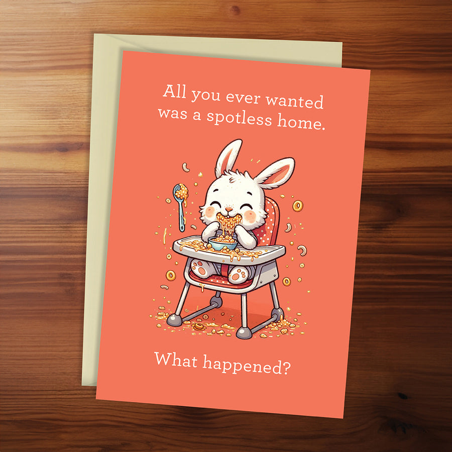 Greeting card with a cartoon rabbit in a high chair on an orange background, featuring humorous text.