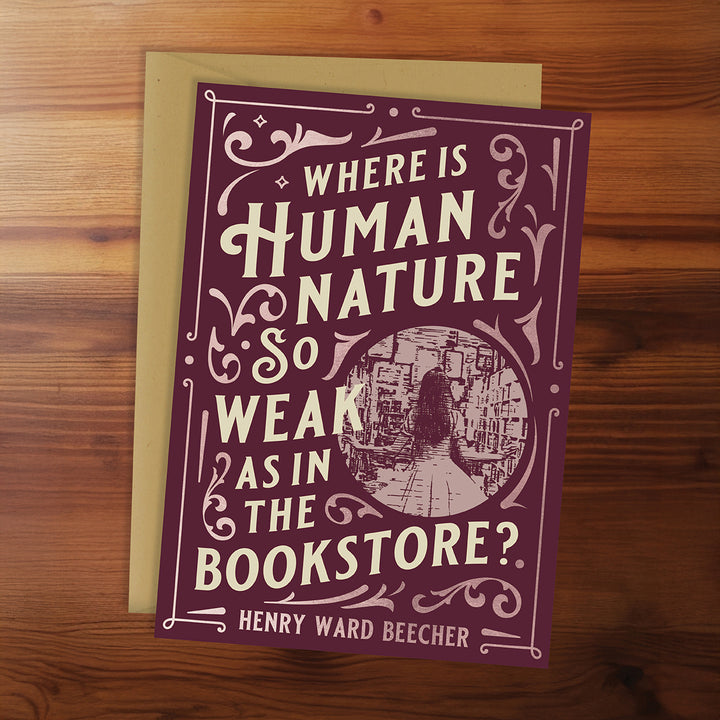 Card with quote 'Where is human nature so weak as in the bookstore?' by Henry Ward Beecher on a wooden surface
