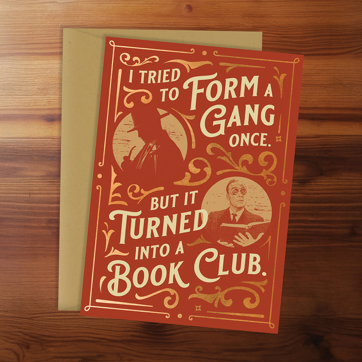 Card with text and illustrations on a wooden surface