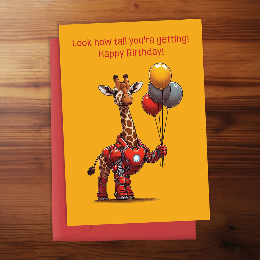 Birthday card with a robot giraffe holding balloons on a wooden surface