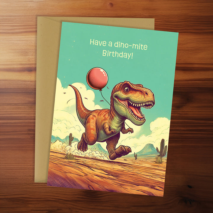 Birthday card with a dinosaur holding a balloon on a wooden surface