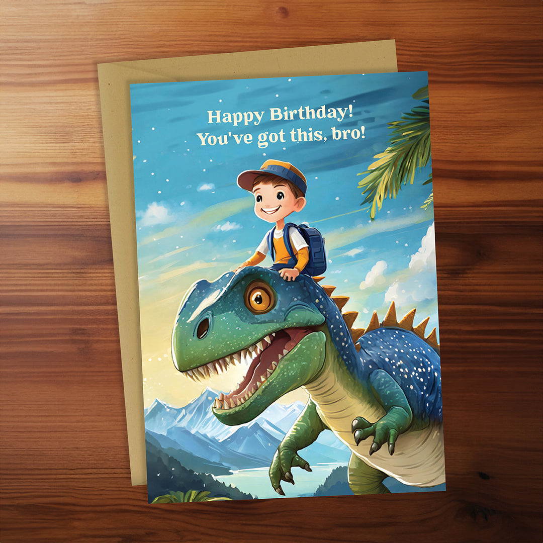 Birthday card with a boy riding a dinosaur on a wooden surface