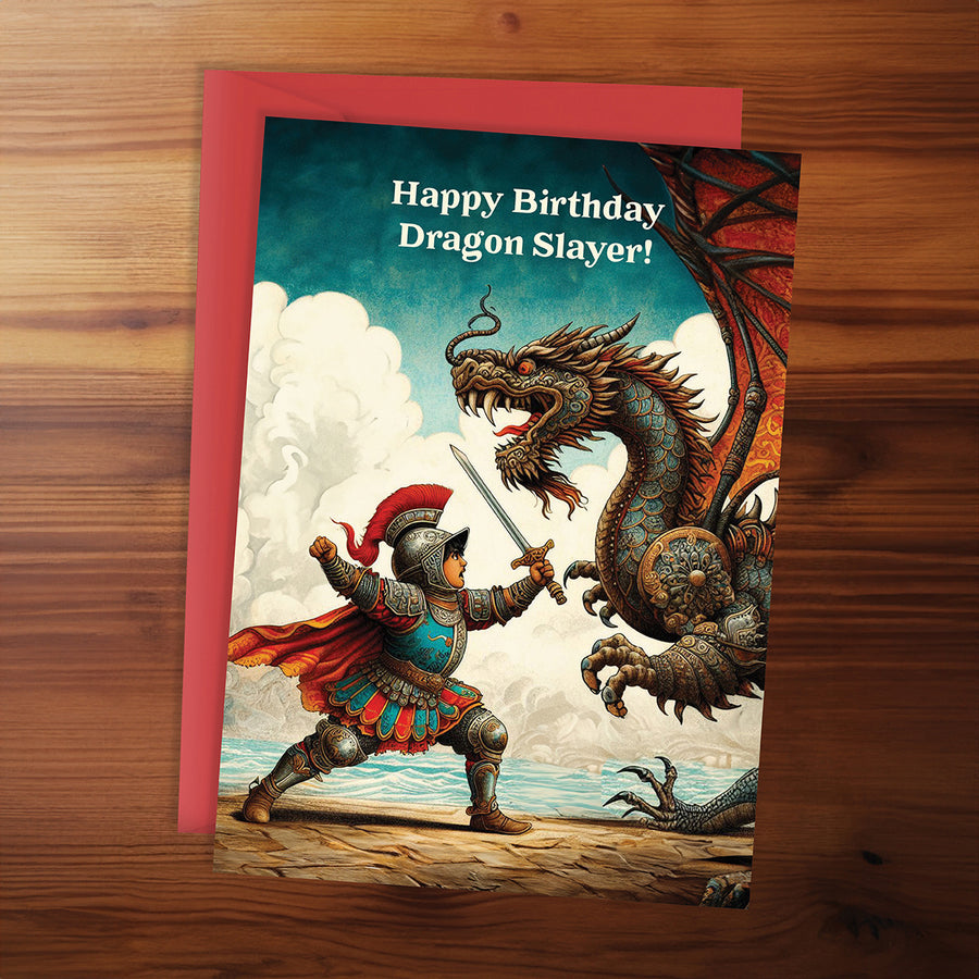 Birthday card with an illustration of a warrior and dragon on a wooden surface