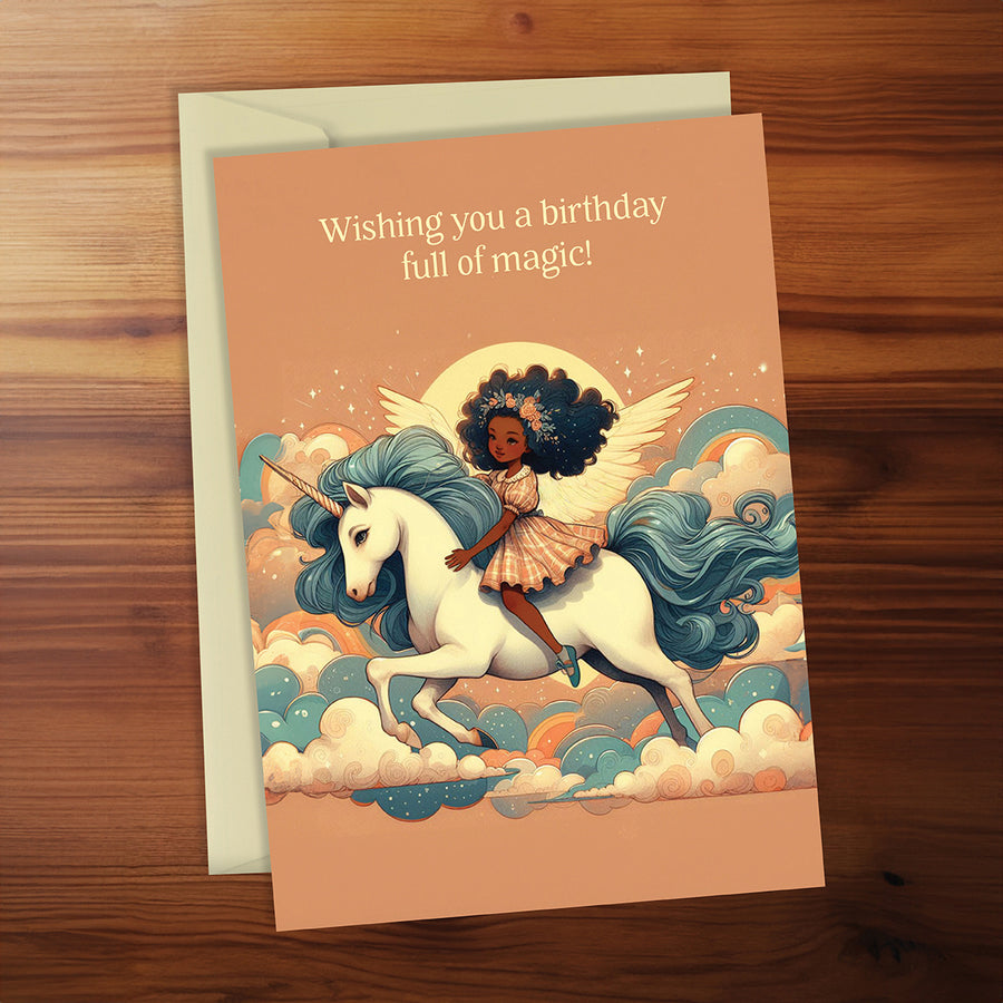 Greeting card with a fairy riding a unicorn on a wooden surface