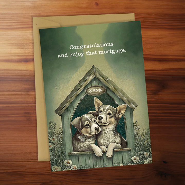 Greeting card with two puppies in a doghouse on a wooden surface
