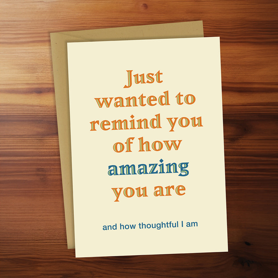 Greeting card with motivational message on a wooden surface