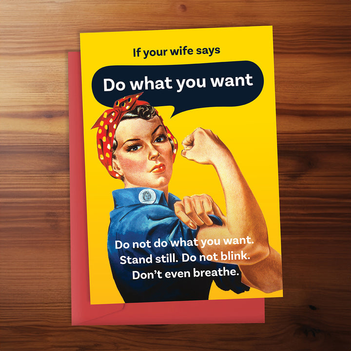 Card with vintage-style illustration of a woman in a blue dress and red headscarf, with text on a wooden surface.