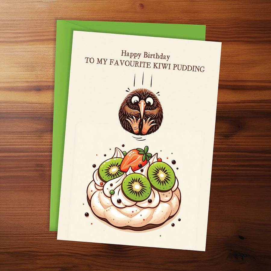 Birthday card with kiwi pudding illustration on a wooden surface
