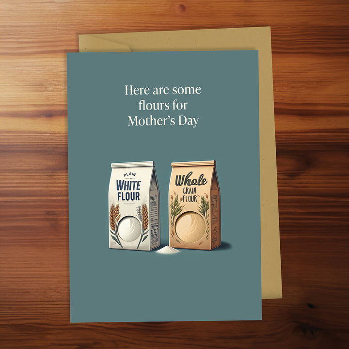 Greeting card with flour packages and text on a wooden surface