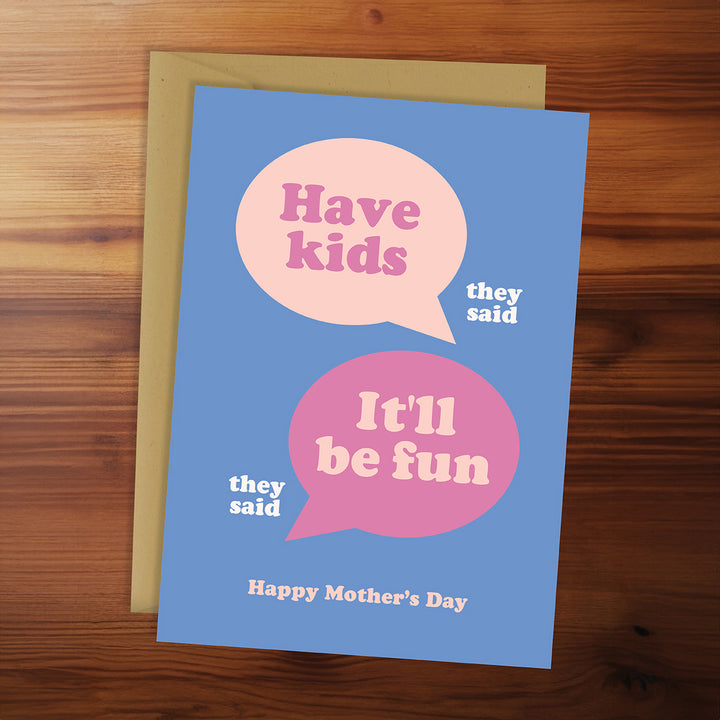 Card with speech bubbles on a wooden surface