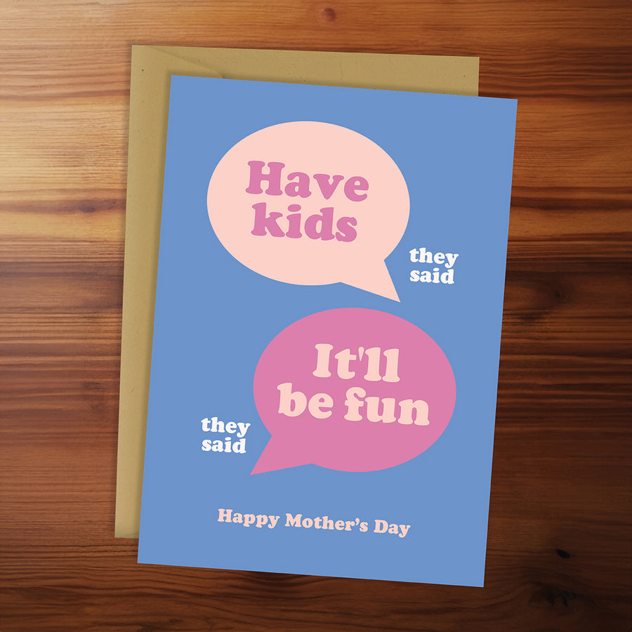Card with speech bubbles on a wooden surface
