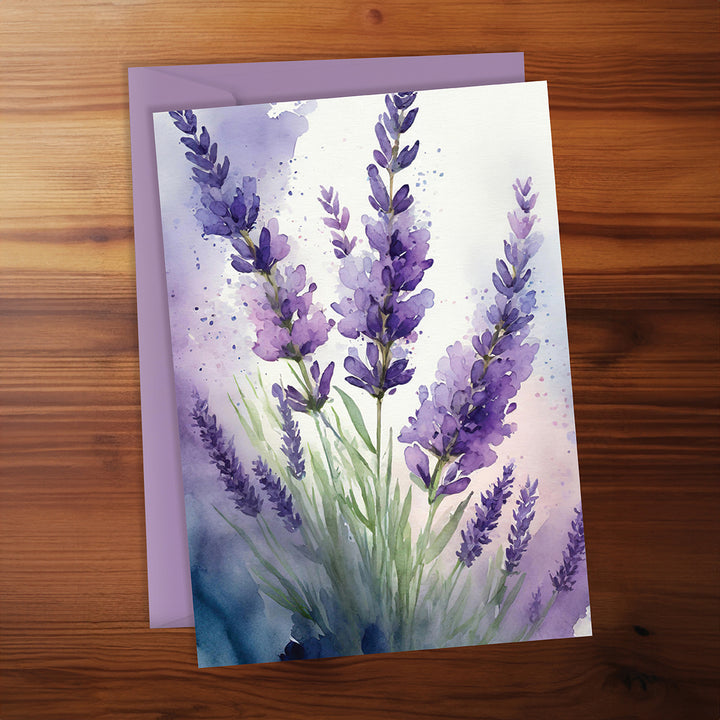 Greeting card with lavender design on a wooden surface