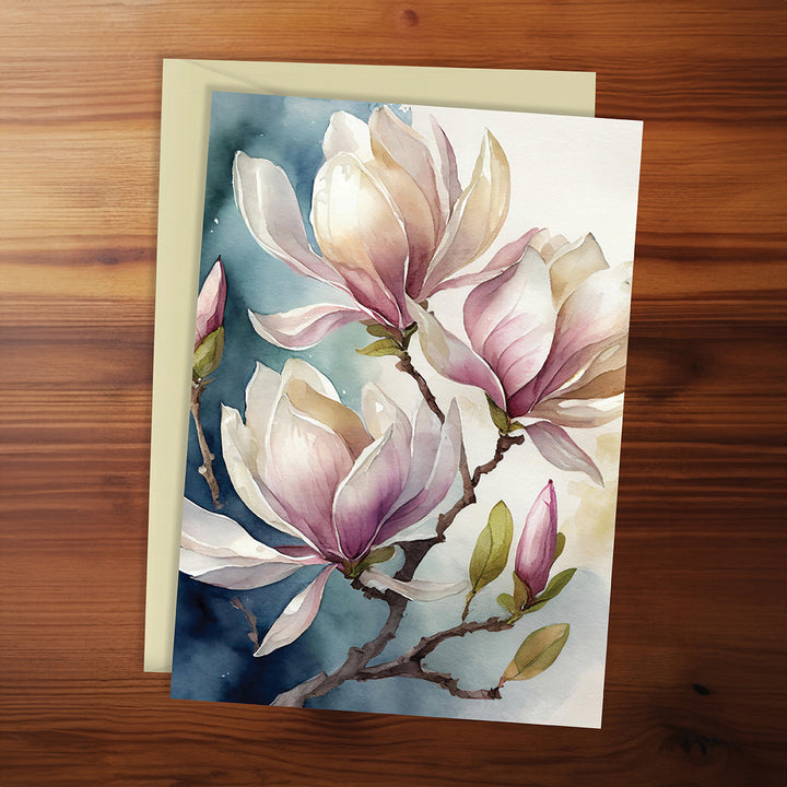 Greeting card with floral design on a wooden surface