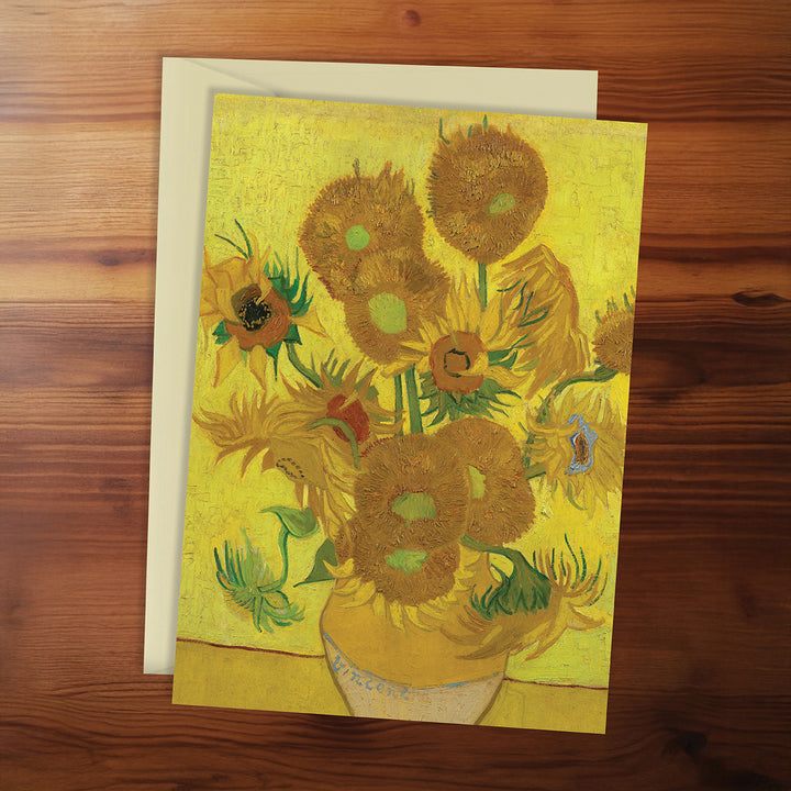 Greeting card with sunflower design on a wooden surface