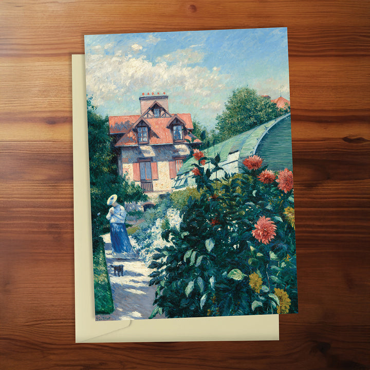 Painting of a woman in a garden with a house in the background on a wooden surface