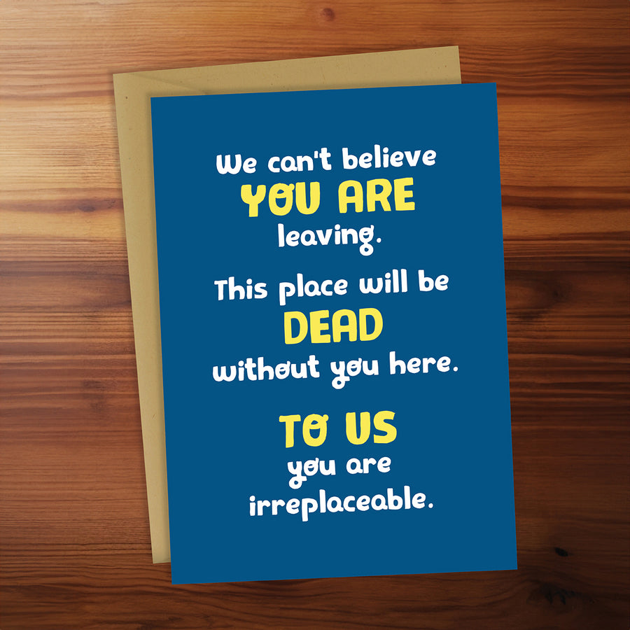 Blue card with yellow and white text on a wooden surface