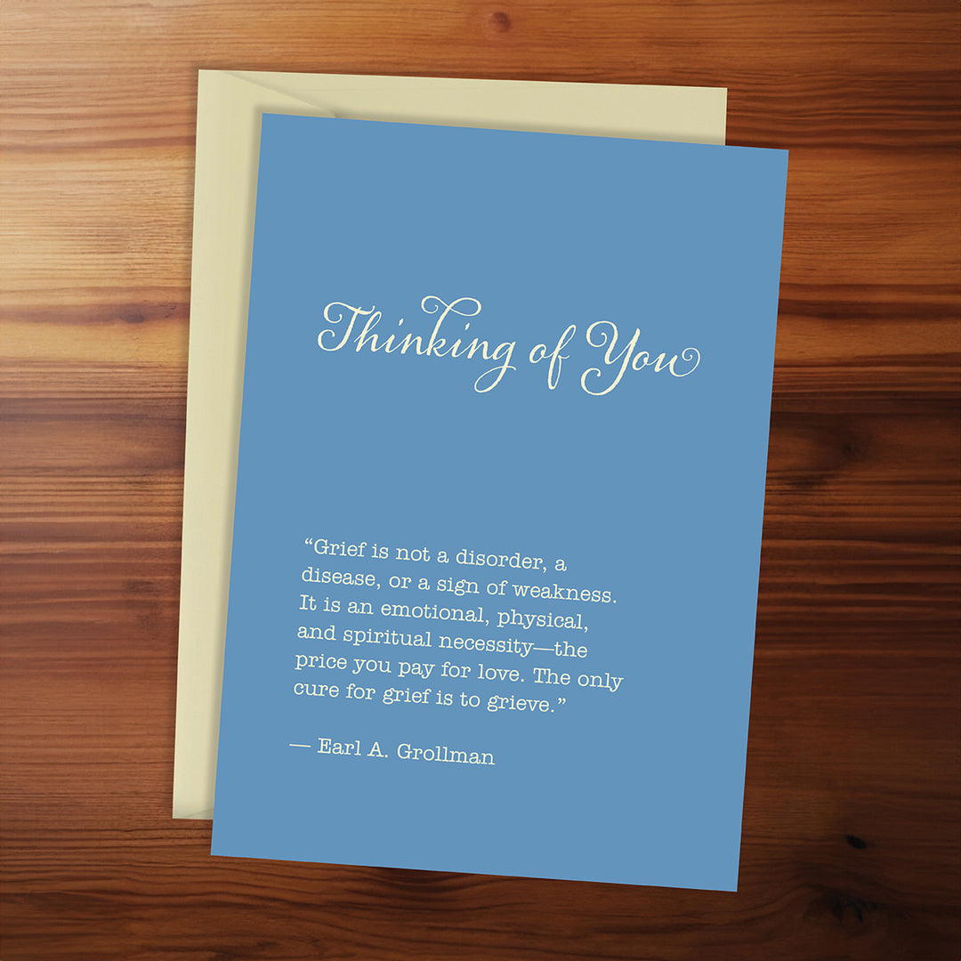 Blue card with text on a wooden surface