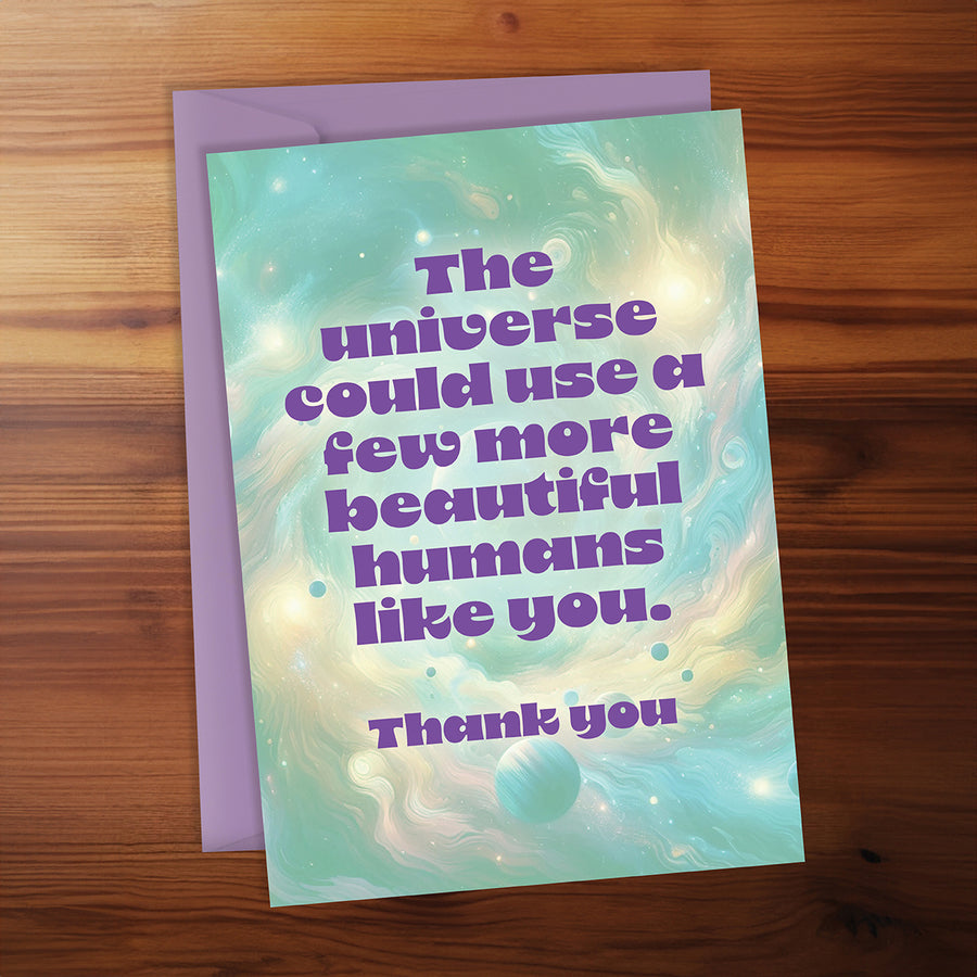 Greeting card with motivational message on a wooden surface