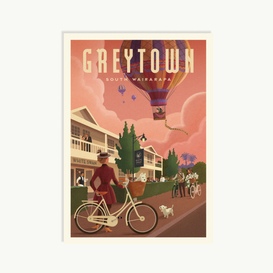 Illustration of a person on a bicycle with a hot air balloon and buildings in the background, featuring the text 'Greytown South Wairarapa'.